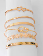 LOVE engraved bangle with floral accents and dainty twist bracelet