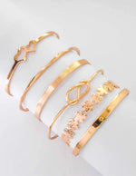 Gold floral cutout bracelet and LOVE engraving bangle