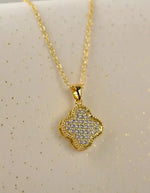 Layering necklace with black and gold reversible pendant