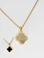 Reversible pendant necklace showing both sparkling and black sides