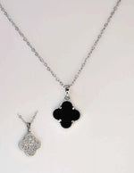 Reversible pendant necklace showing both sparkling and black sides detail