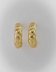 Bold twisted gold earrings with high-polish shine