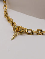Bold gold link necklace styled for luxury look