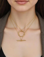gold circle bar necklace with double chain close-up