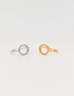 Gold minimalist open-circle engagement ring closeup