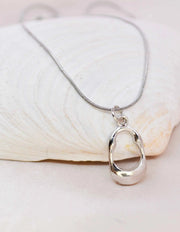Montreal-inspired sterling pendant with curved edges