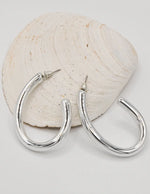 silver_oval_shiny_hoops_earrings_for_women_minimalist_jewelry_montreal_canada