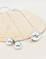 silver radiant orb jewelry set with bold circle pendant necklace and earrings perfect for layering jewelry for women in canada
