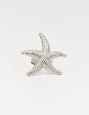 Silver starfish ring showcasing intricate dotted detailing
