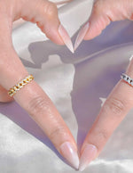elegant women's promise ring displayed on white satin