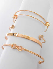 ForeverUs gold charm bracelet stack with infinity loop