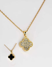 Reversible pendant necklace showing both sparkling and black sides