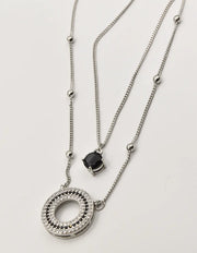 silver circle pendant necklace Canada featuring halo design with black accents, ideal layering necklaces for women