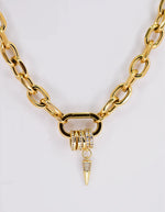 Bold gold link necklace styled for luxury look