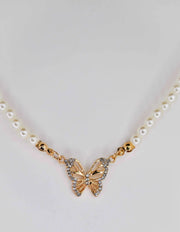 Layered pearl necklace with sparkling butterfly pendant


