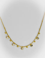 Minimalist gold necklace with dainty zircon and bead charms