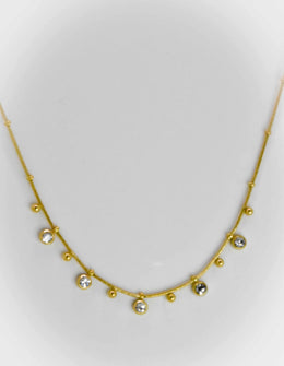 Minimalist gold necklace with dainty zircon and bead charms