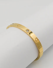 Stylish gold bangle with heart cut-outs for women