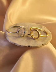 Side view of gold ring with cubic zirconia circle detail