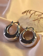Timeless silver hoop earrings with bold rounded shape
