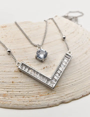 silver initial necklace with v pendant and crystal charm on chain