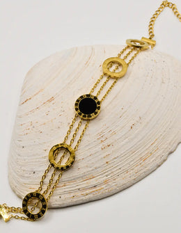 luxury_noir_orbit_golden_layered_bracelet_with_black_enamel_canada_jewelry