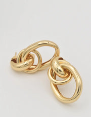Gold double loop drop earrings with sculptural design

