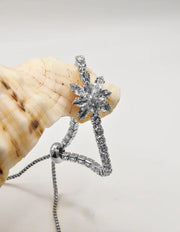 radiant_blossom_happy_face_bracelet_closeup_on_elegant_silver_floral_charm_canada