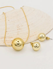 gold circle pendant necklace canada paired with bold round stud earrings, dainty yet modern layering necklaces for women montreal style