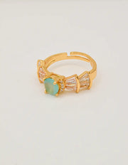 sea_mist_adjustable_ring_on_shell_front_view – gift for her jewelry montreal adjustable gold ring with sea mist stone
