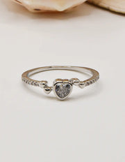 Silver Glow Heart Eternity Ring with a sparkling heart‑shaped stone set in a delicate pave band; this minimalist jewellery is ideal for Canadian shoppers seeking TikTok viral accessories and a dainty gift for her.