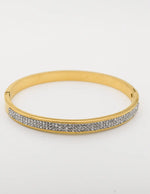 Gold charm bracelet with silver pave crystals