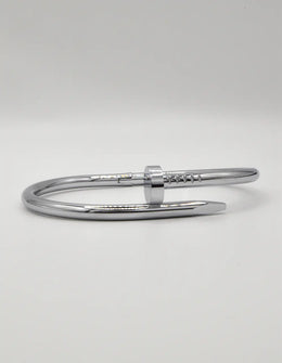 Polished silver steel twist nail bracelet, trending unisex Canadian jewellery design.