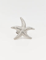 Silver starfish ring showcasing intricate dotted detailing