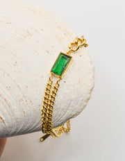 luxury_golden_chain_bracelet_with_green_rectangular_stone_montreal