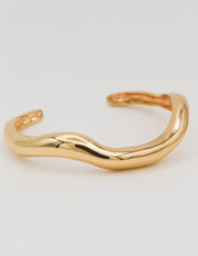 Open-cuff 18K gold bangle on white background