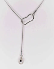 Modern silver necklace on white background, clean design