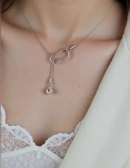 Sleek Y-drop silver necklace with sculpted loop pendant

